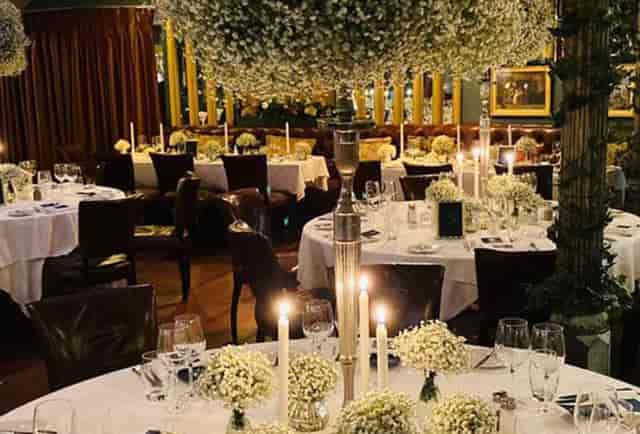 Elegant Marco Pierre White Donnybrook table setting with floral centerpieces for formal dining.