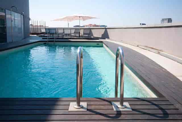 Rooftop breakout space at Hotel Barcelona Condal Mar for corporate cocktail hours and VIP mixers.