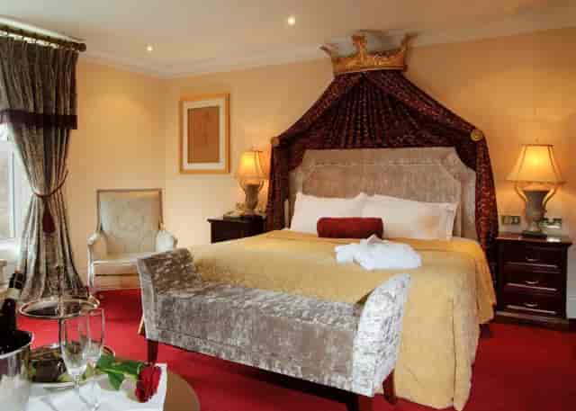 Luxury hotel suite at Muckross Park, featuring theatrical decor for VIP event accommodation.