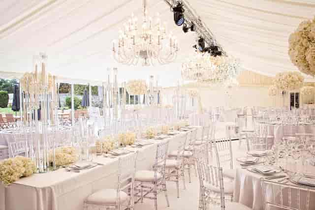 Luxury white marquee wedding reception with crystal candelabras at Carlowrie Castle Orangery.