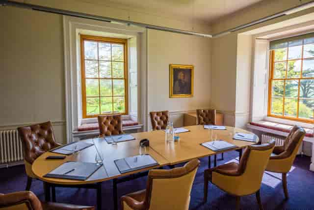 Winchester Suite boardroom set for eight, ideal for executive strategy sessions and meetings.