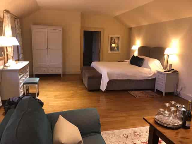Luxury Pavilion Suites hotel room with workspace, ideal for VIP accommodations and speaker lodging.