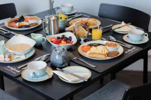 High-end breakfast setup at The Scholar for intimate board meetings and VIP corporate events.