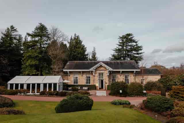 Caledonian Hall at Royal Botanic Garden Edinburgh: wedding venue with marquee and stone building.