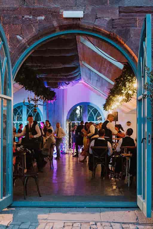 Intimate Broxmouth Courtyard dining room with hanging greenery for weddings and corporate events.