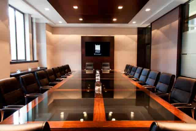 Stirling Suite boardroom for C-suite meetings and formal contract signings with presentation screen.
