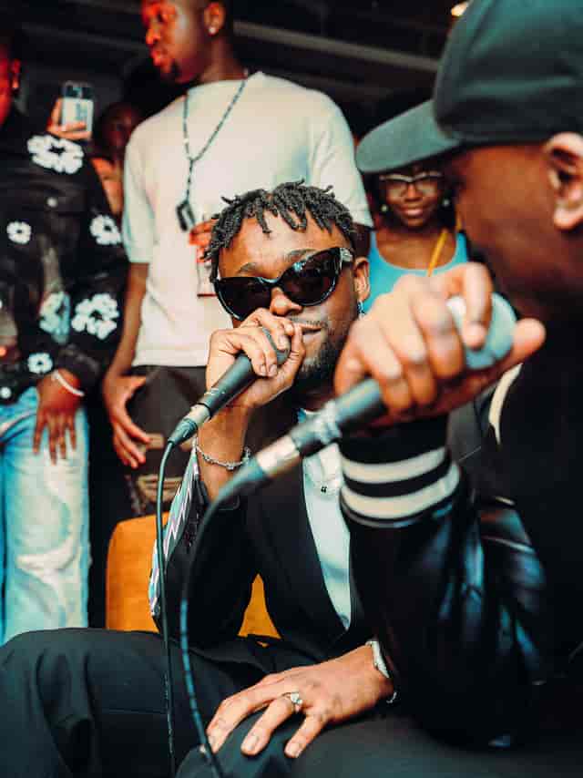 Vibrant live performance at Cafe KOKO, showcasing dynamic artist and engaged crowd.