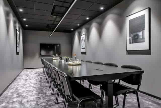 Modern boardroom at Fleminggatan 18 with integrated tech for high-stakes corporate meetings.