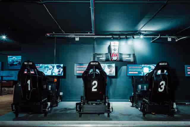 Modern racing simulators in Race Lounge, K1 Speed for esports tournaments and team-building.