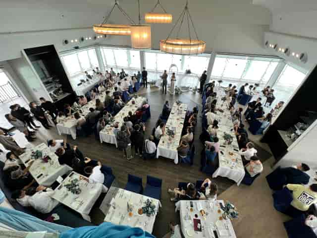 Wedding reception at Watermark Hong Kong featuring elegant long-table dining setup.