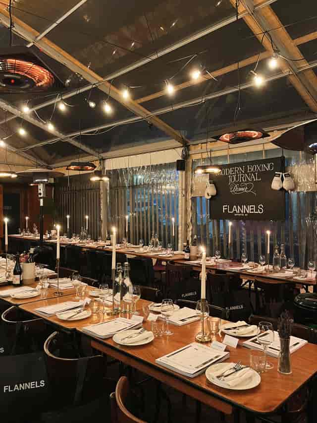 Elegant dining setup in a tent at Private Hire Brat x Climpson's Arch for corporate events.