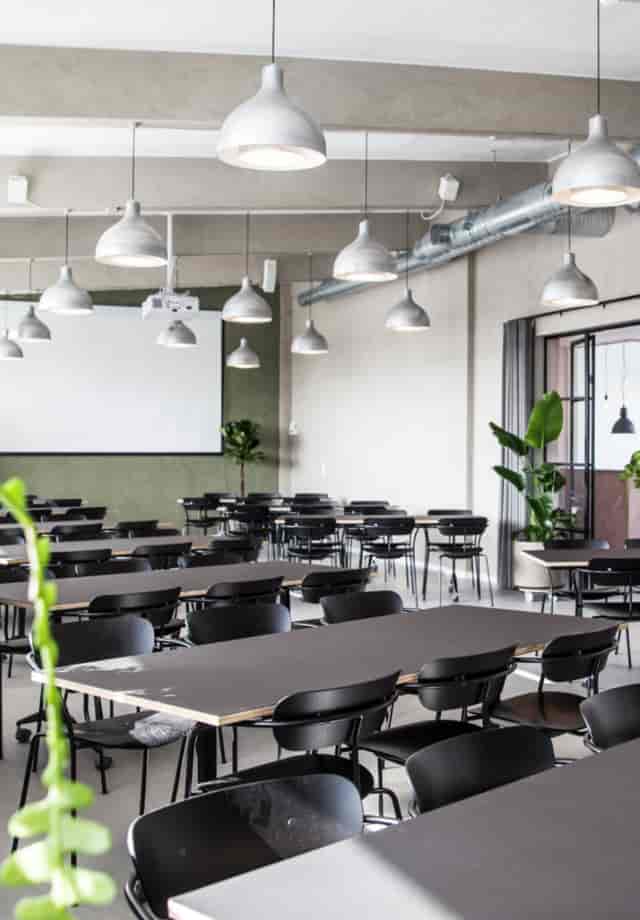 Industrial-chic SOHO Copenhagen rooftop meeting space for workshops and corporate training.
