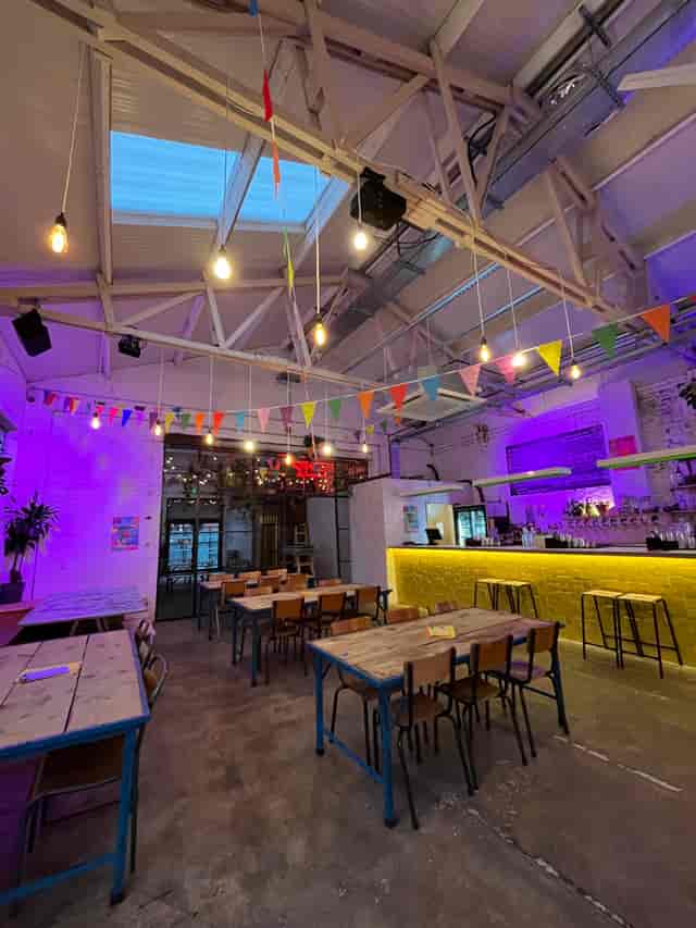 Industrial-chic event space with raw architecture for networking and team building.
