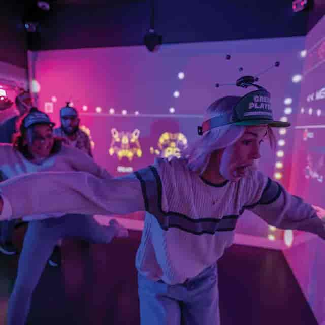 Immersive Gamebox team-building event with vibrant lighting and interactive fun.