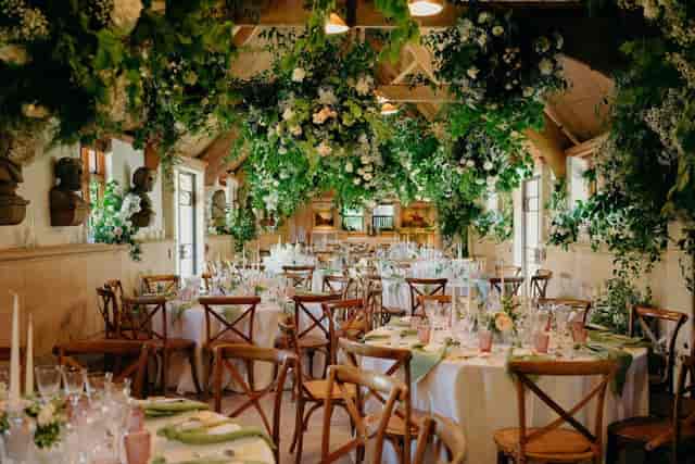 West Hall floral event décor, immersive rustic wedding venue transformation.