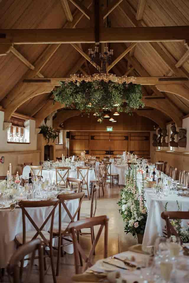 West Hall rustic banquet with floral installation for luxury weddings and corporate gala events.