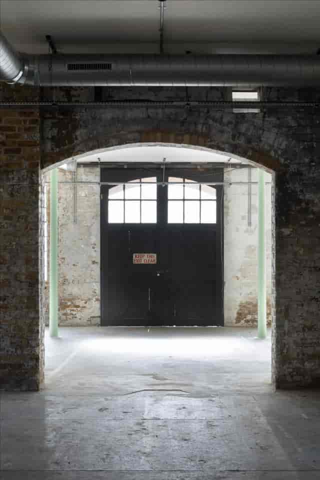 Industrial exhibition venue with raw character for corporate events and brand activations.