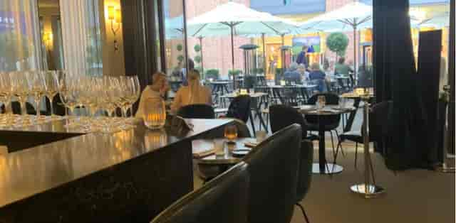Les Deux Brasserie lounge and terrace for corporate networking events and breakout sessions.
