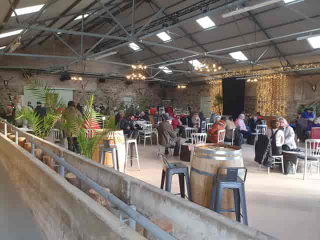 Rustic industrial networking venue at Hall in Rottal Estate with barrel tables for events.