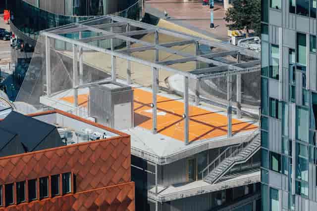 Rooftop basketball court in Design District: Industrial event venue for team building and networking.
