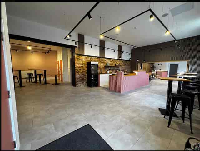 Sewardstone Park Suite industrial event space with bar for networking and team gatherings.