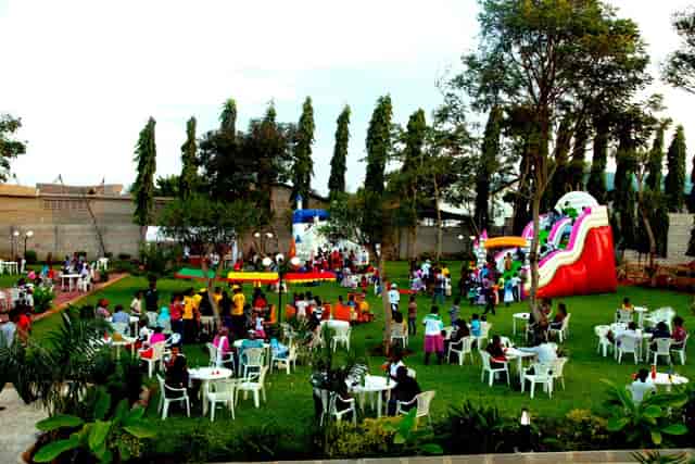 Shekinah Garden family day: colorful inflatables and cafe seating for outdoor event venue rental.