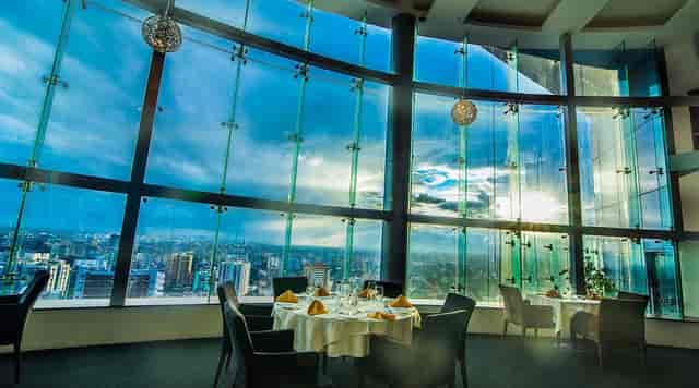 VIP dinner venue at Kinaya Bar with floor-to-ceiling city views for executive networking.