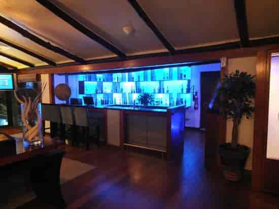 Intimate Karambezi Café bar with chic lighting, ideal for networking events and cocktail parties.