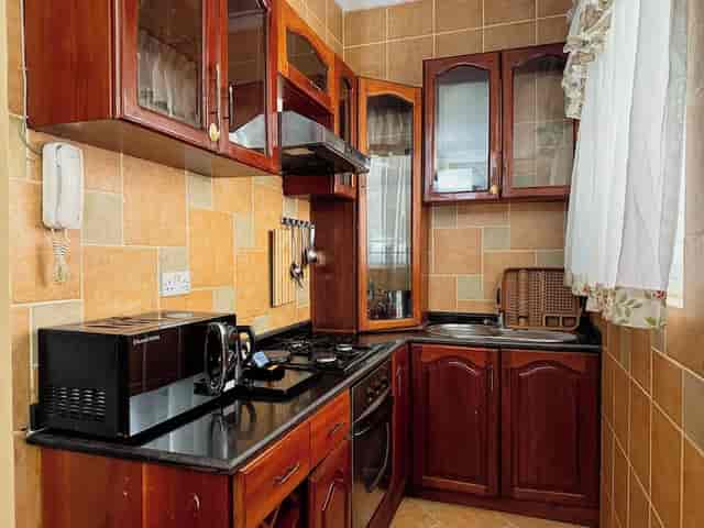 Dated kitchenette at The Amariah Hotel Mikocheni, poor catering setup for event planning.
