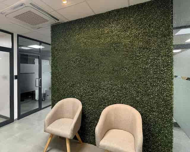 Biophilic accent wall at The Hive, ZO Spaces: professional event backdrop and social media corner.
