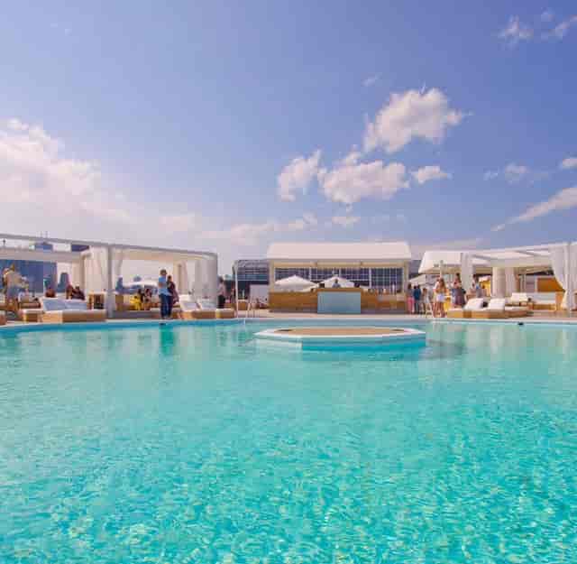 Luxury rooftop lounge at Cabana Toronto with poolside bar for corporate networking events.