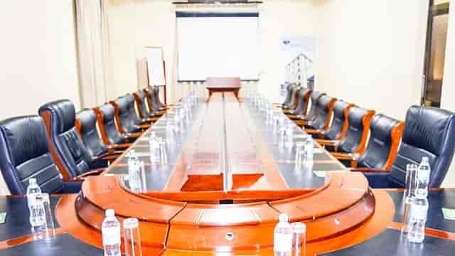 Boardroom at Lifelights Hotel Academica with executive chairs for formal corporate meetings.