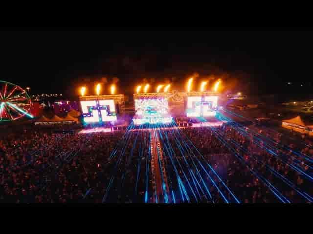 Rainbow Lounge stage with LED displays and pyrotechnics at North Coast Music Festival.