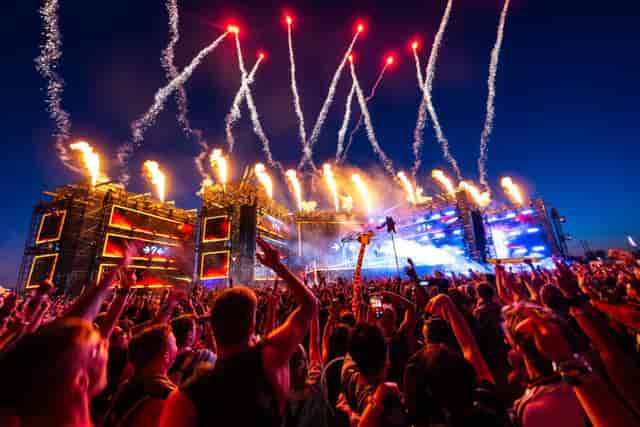 North Coast Music Festival sports complex concert with pyro and LED staging for live music event.