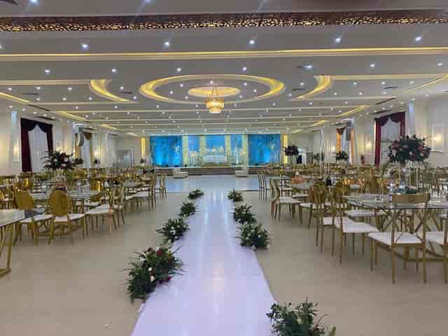 Dream Land Social Hall ballroom with gold seating for formal wedding ceremony and reception.