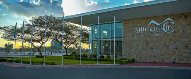 Mlimani City conference centre: modern glass exterior for professional events and business summits.
