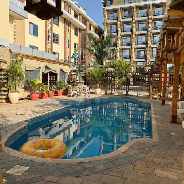 Poolside networking reception at Rafiki Dodoma Hotel conference venue.