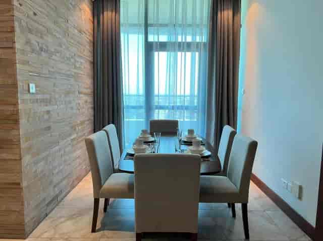 Executive boardroom at Fairview Luxury Apartments with natural light for corporate meetings.