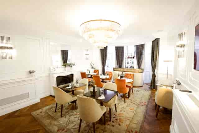 Elegant meeting room at Chesham Hotel with plush seating, perfect for upscale events.
