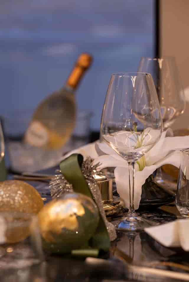 Elegant Lacquer Room table setting with floral accents for upscale gala and formal dinner events.