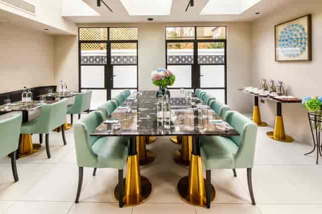 Private Room at Ellen Kensington with black marble table for executive meetings and fine dining.