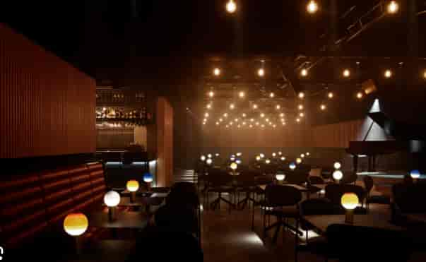 Elegant reception venue with grand piano for corporate events and intimate showcases.