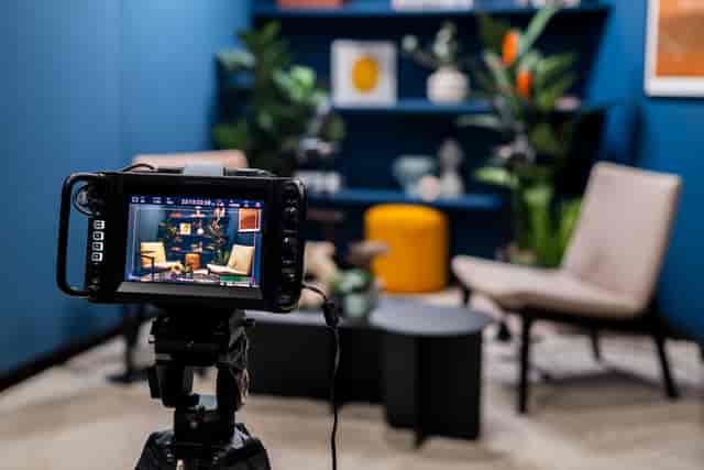 Virtual meeting setup in Qube Elephant Lounge, featuring cozy seating and decor.
