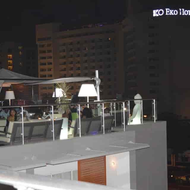Four Degrees Bar rooftop lounge with ambient lighting for high-end networking and evening events.