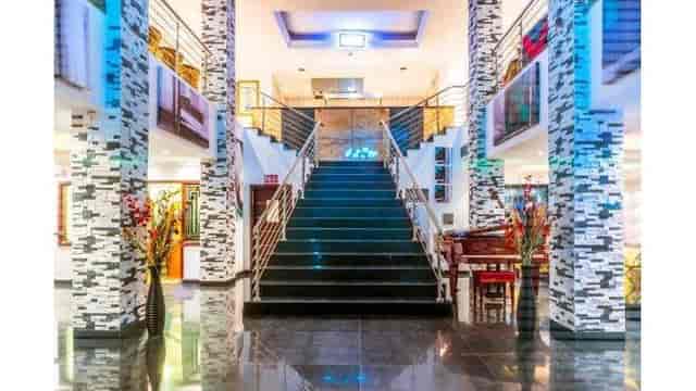 Opulent lobby with grand staircase at Protea Hotel Lagos for corporate event or cocktail reception.