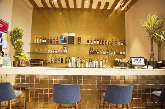 Luxury gold bar at Jinja, EbonyLife Place, ideal for intimate VIP networking and event receptions.
