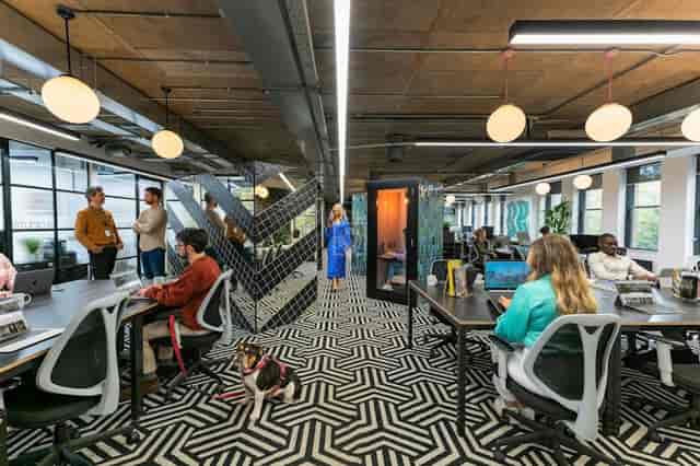 Modern open-plan office at Apex Iconic Castle Event Center for hybrid networking and team workshops.