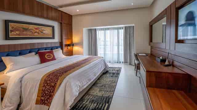 Modern VIP hotel room at The Lilygate Lagos with workspace for luxury event accommodation.