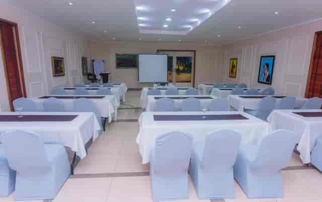Classroom setup in La Cour Hotel meeting room for corporate training and presentations.