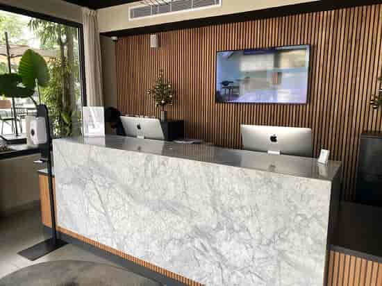 Modern hotel reception desk for corporate event registration and professional conference venues.